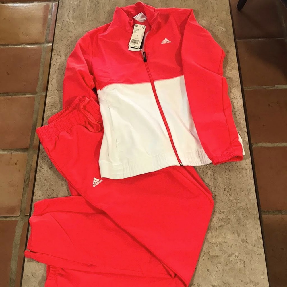 Adidas light red woman’s tracksuit
